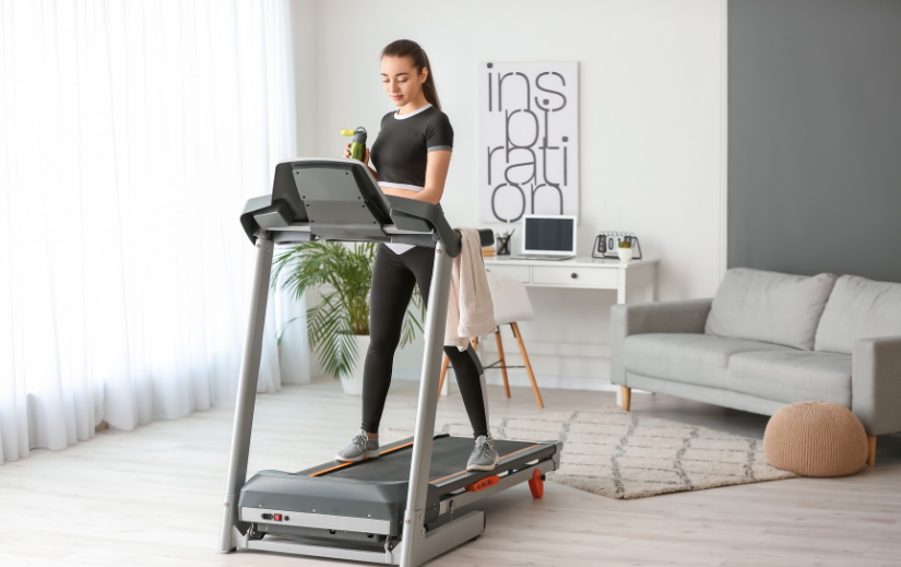 Woman on a treadmill in a home gym, ideal for affiliate marketing programs promoting fitness equipment.